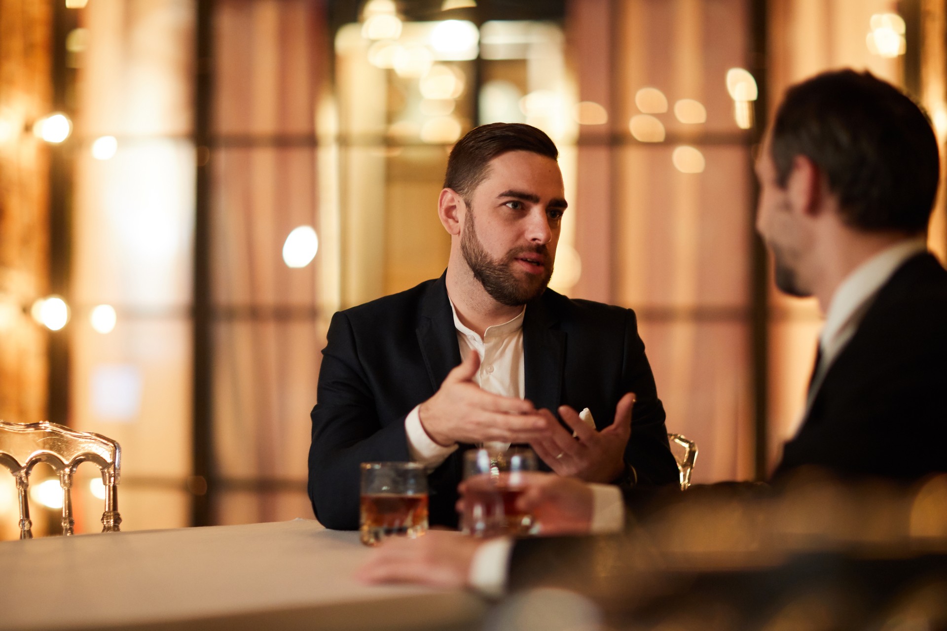 Two Business People Talking in Restaurant